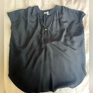 Black silk cap sleeve blouse. Notch collar and 1 button. Good condition.